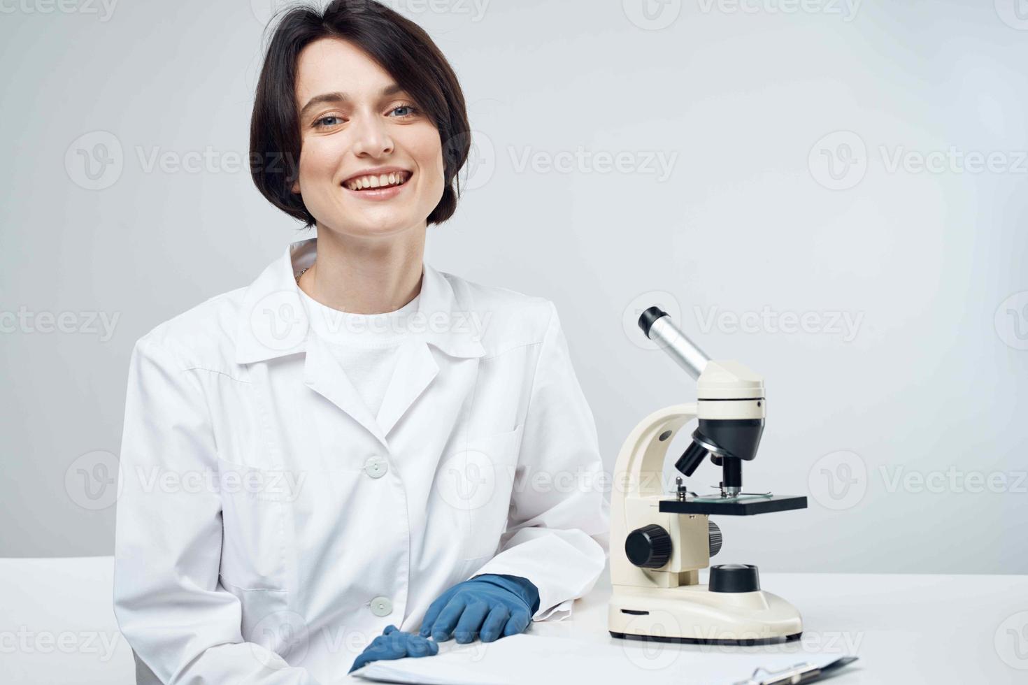 woman scientist laboratory microscope biotechnology photo