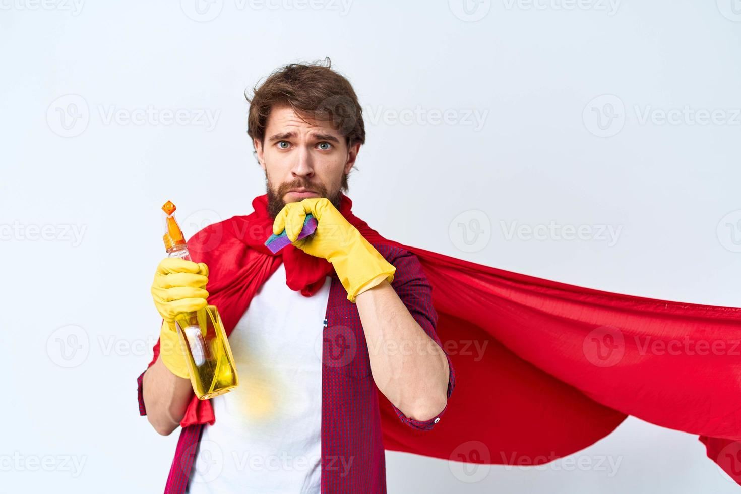 Man in red raincoat cleaning supplies housework service Professional photo