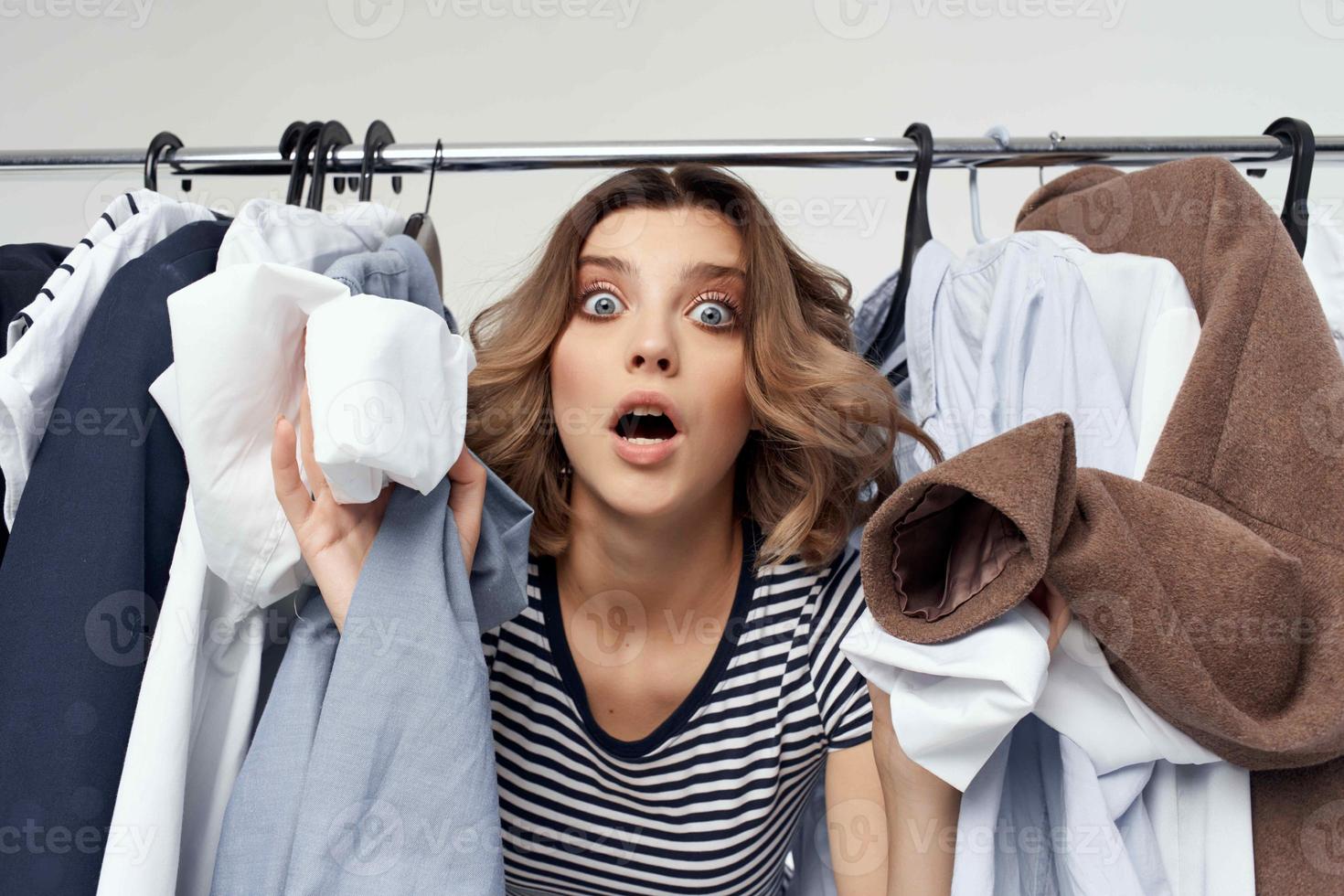 pretty woman trying on clothes shop retail isolated background photo