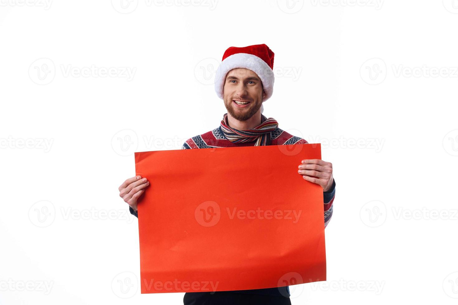 Cheerful man in a christmas hat with Red mockup poster copy-space studio photo