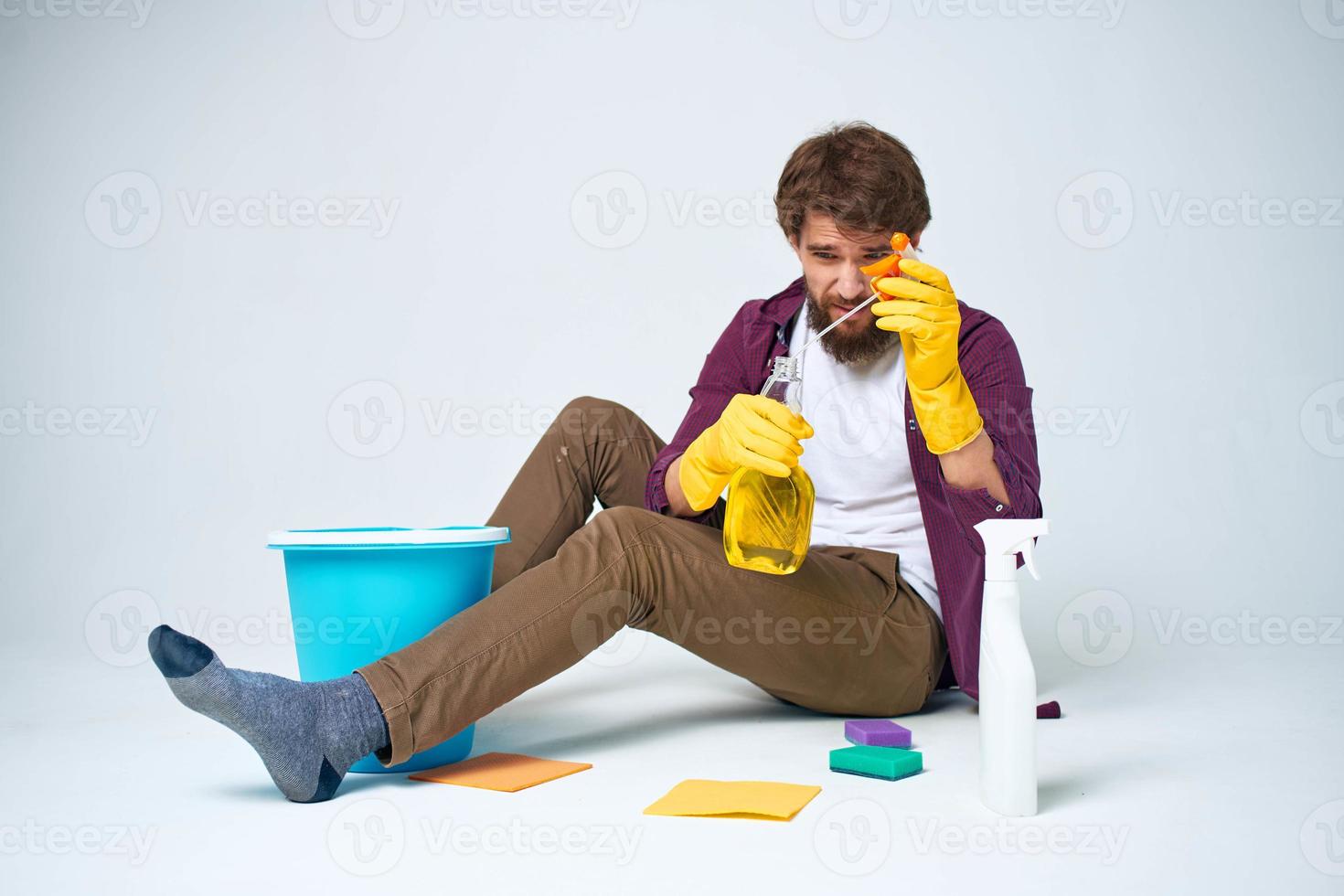 cleaner lying on the floor with a bucket of detergent cleaning service rendering Professional photo