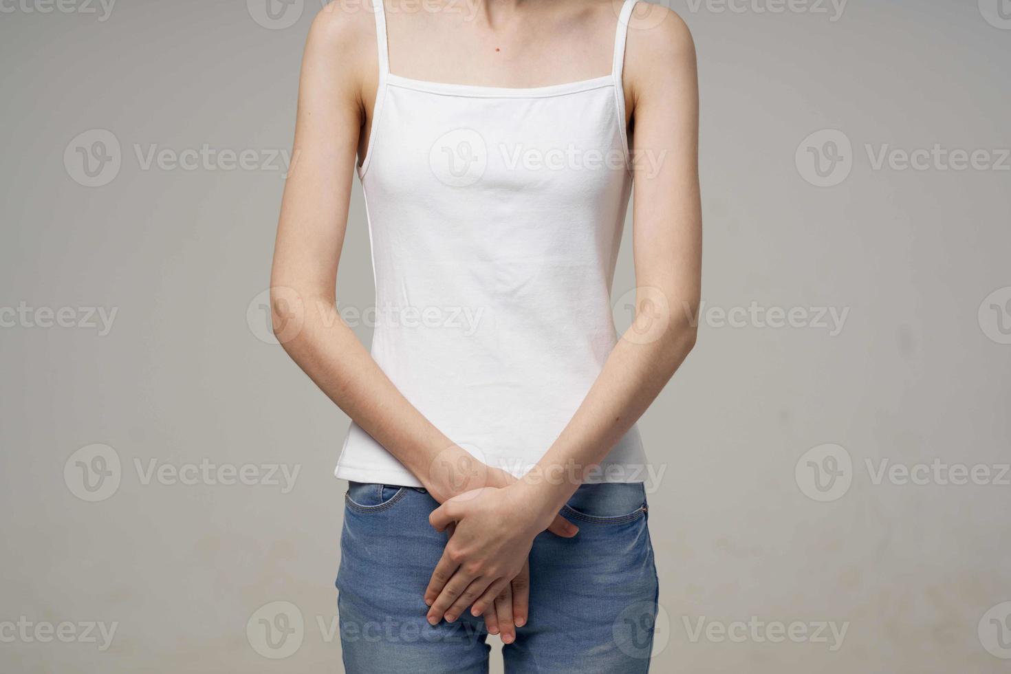 sick woman groin pain intimate illness gynecology light background photo