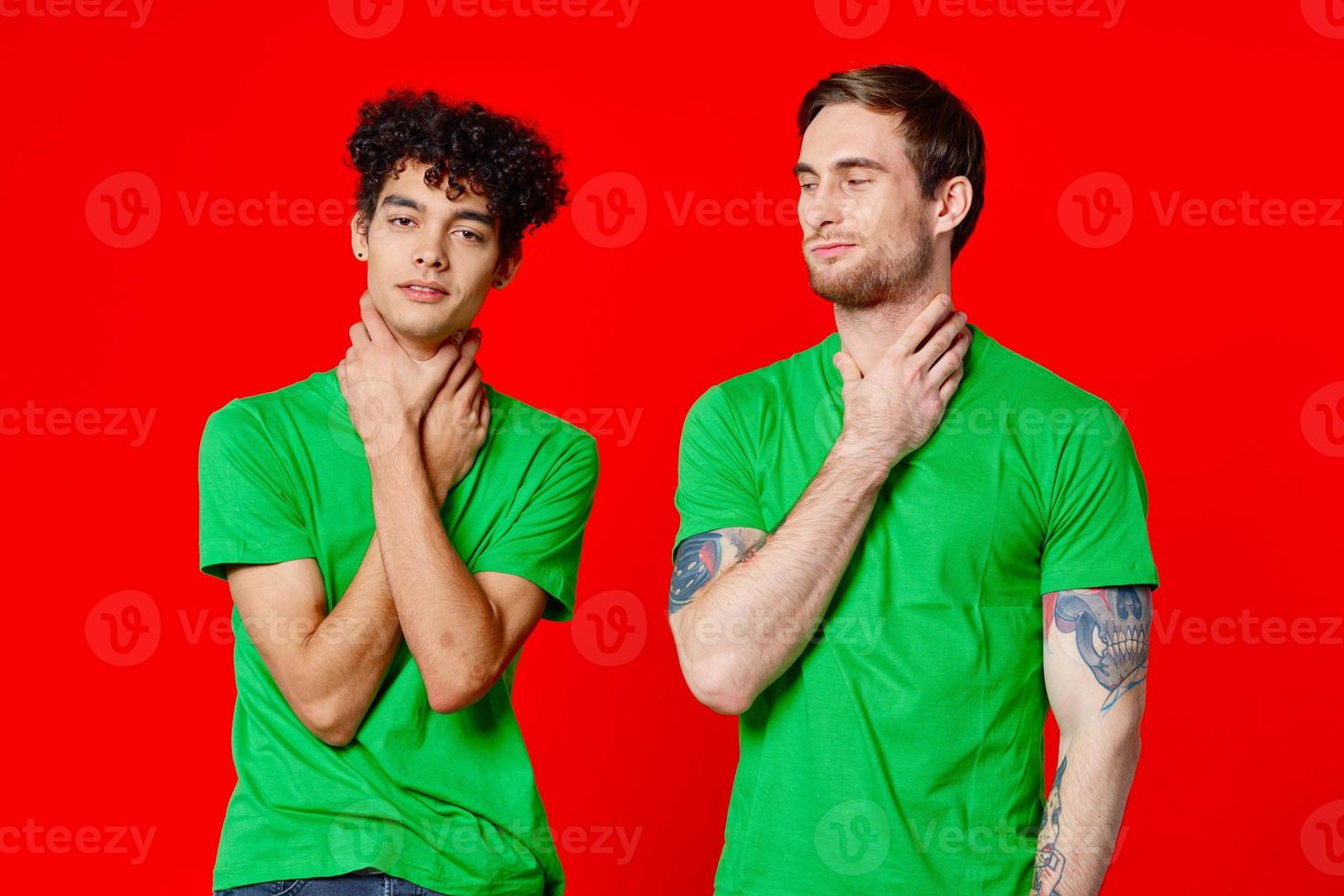 two man holding his neck emotions discontent red background photo