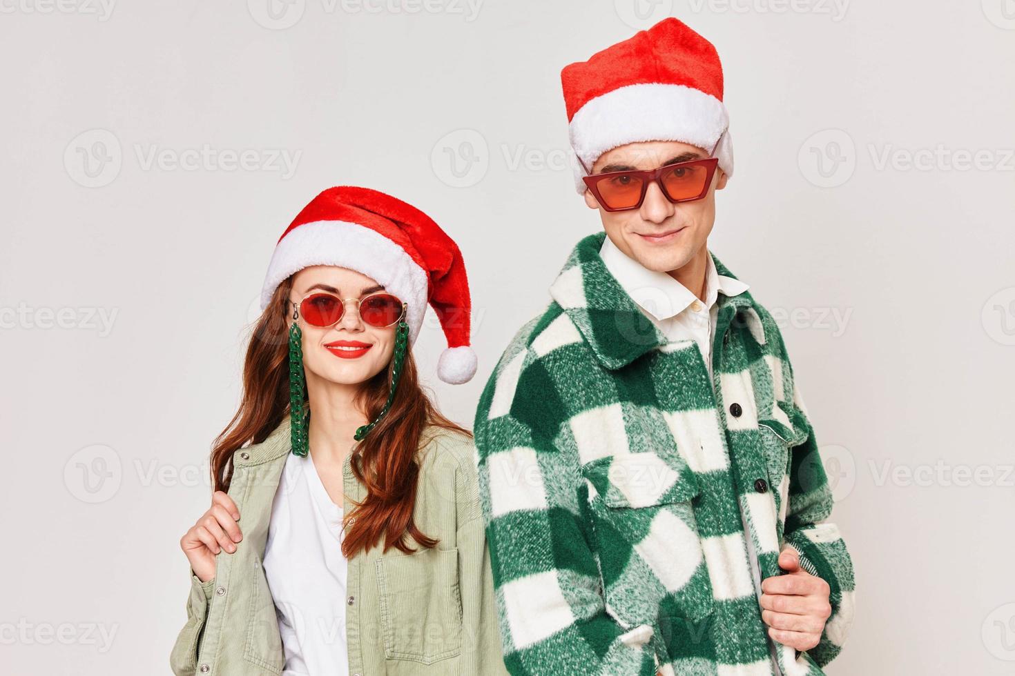 Man and woman are standing next to New Years fun winter holiday Christmas photo