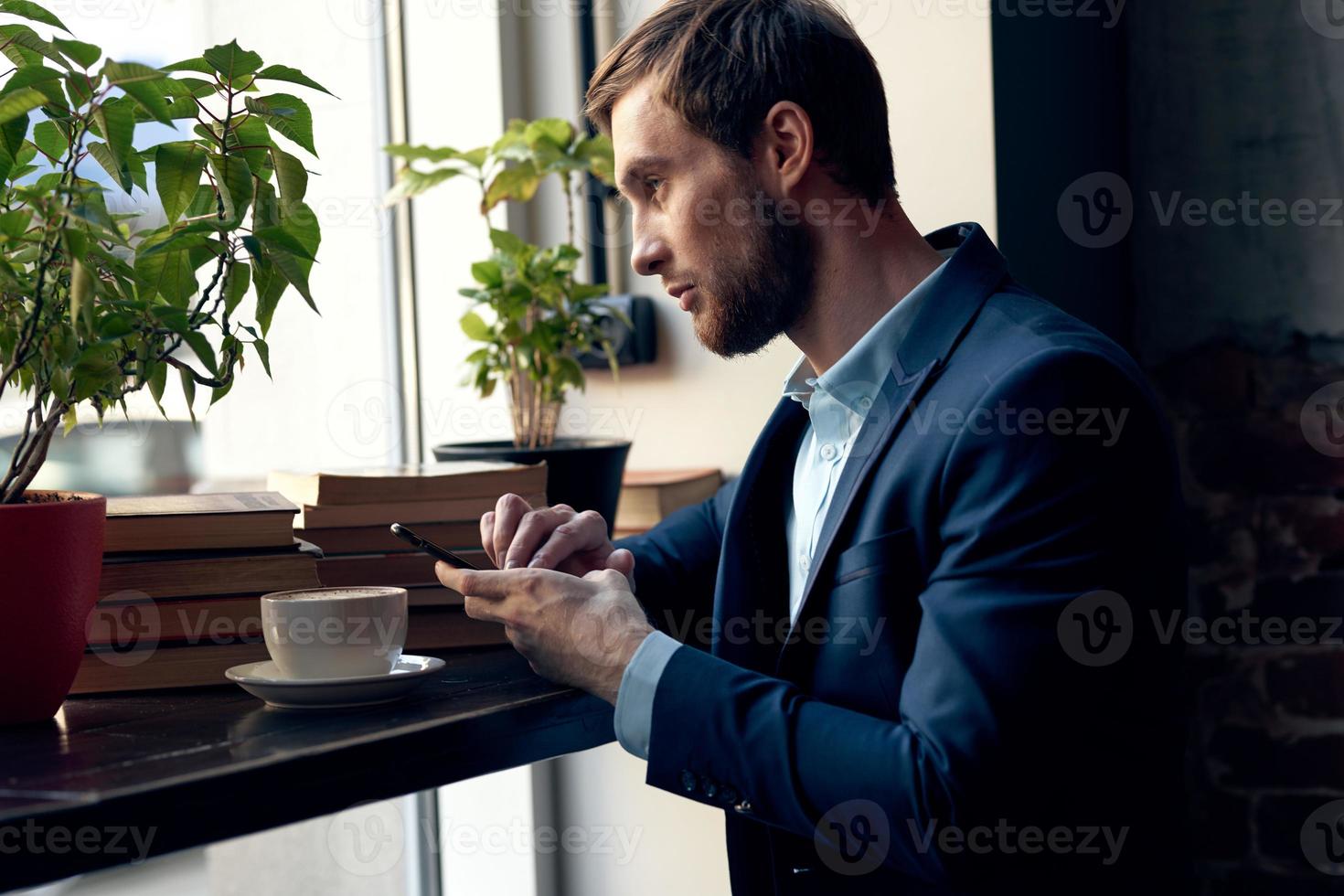 business man in a suit sitting at a table in a cafe leisure breakfast professional photo