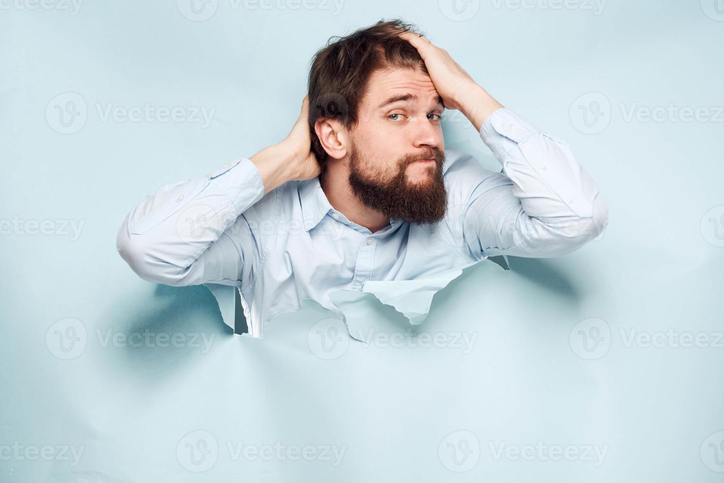 A man gestures with his hands in the shirt of an office manager official working photo