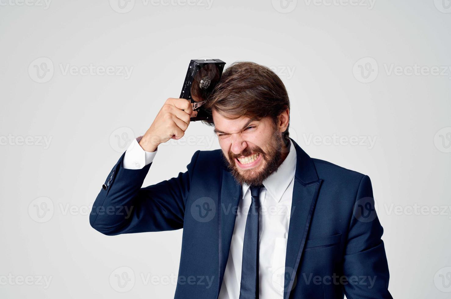 business man in suit and technology hard drive information photo