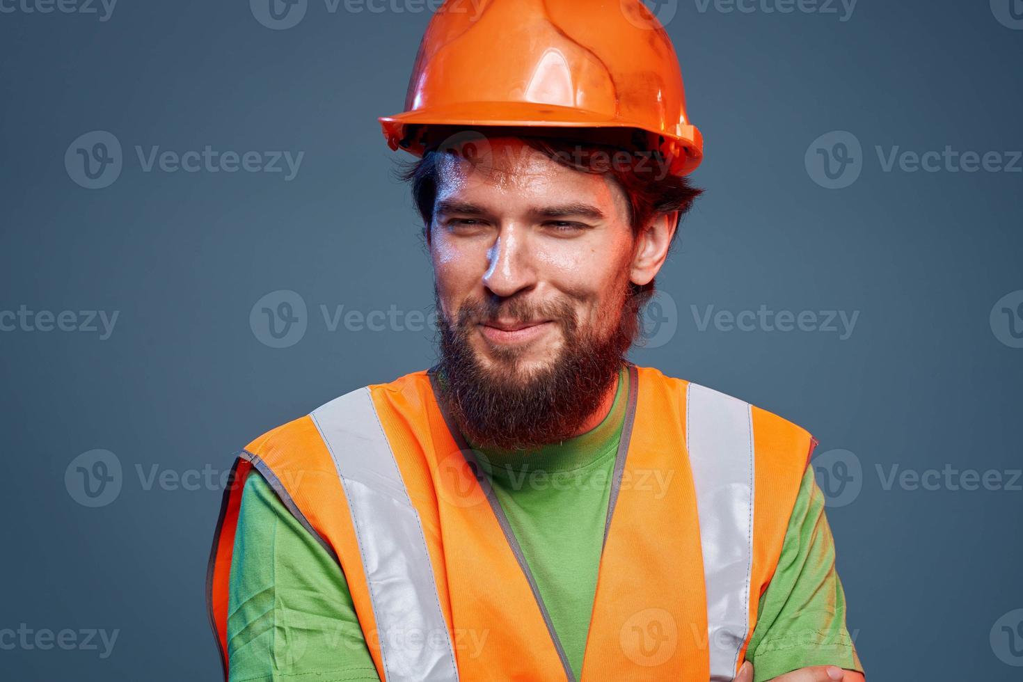 Bearded man in orange paint construction safety hard work photo