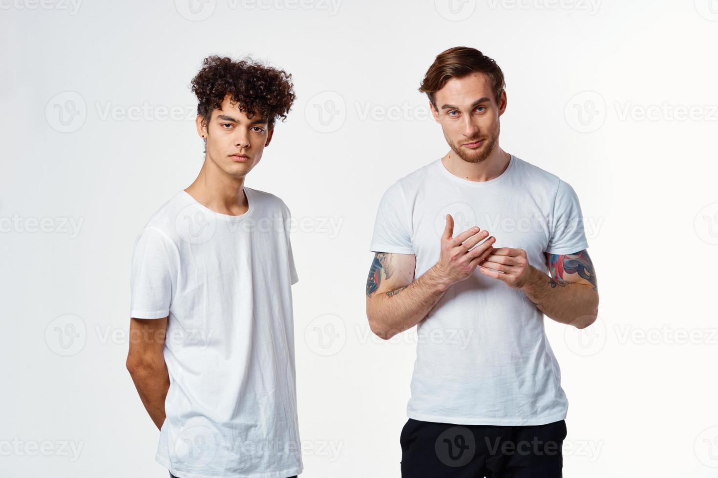 two men in white t-shirts emotions friendship fun photo