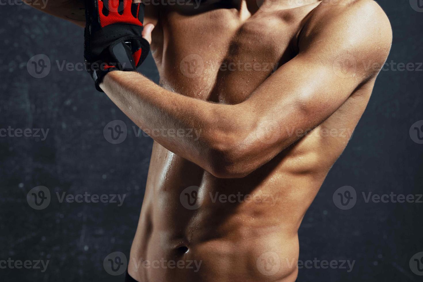 man with a pumped-up torso towels in his hands and workout motivation model photo
