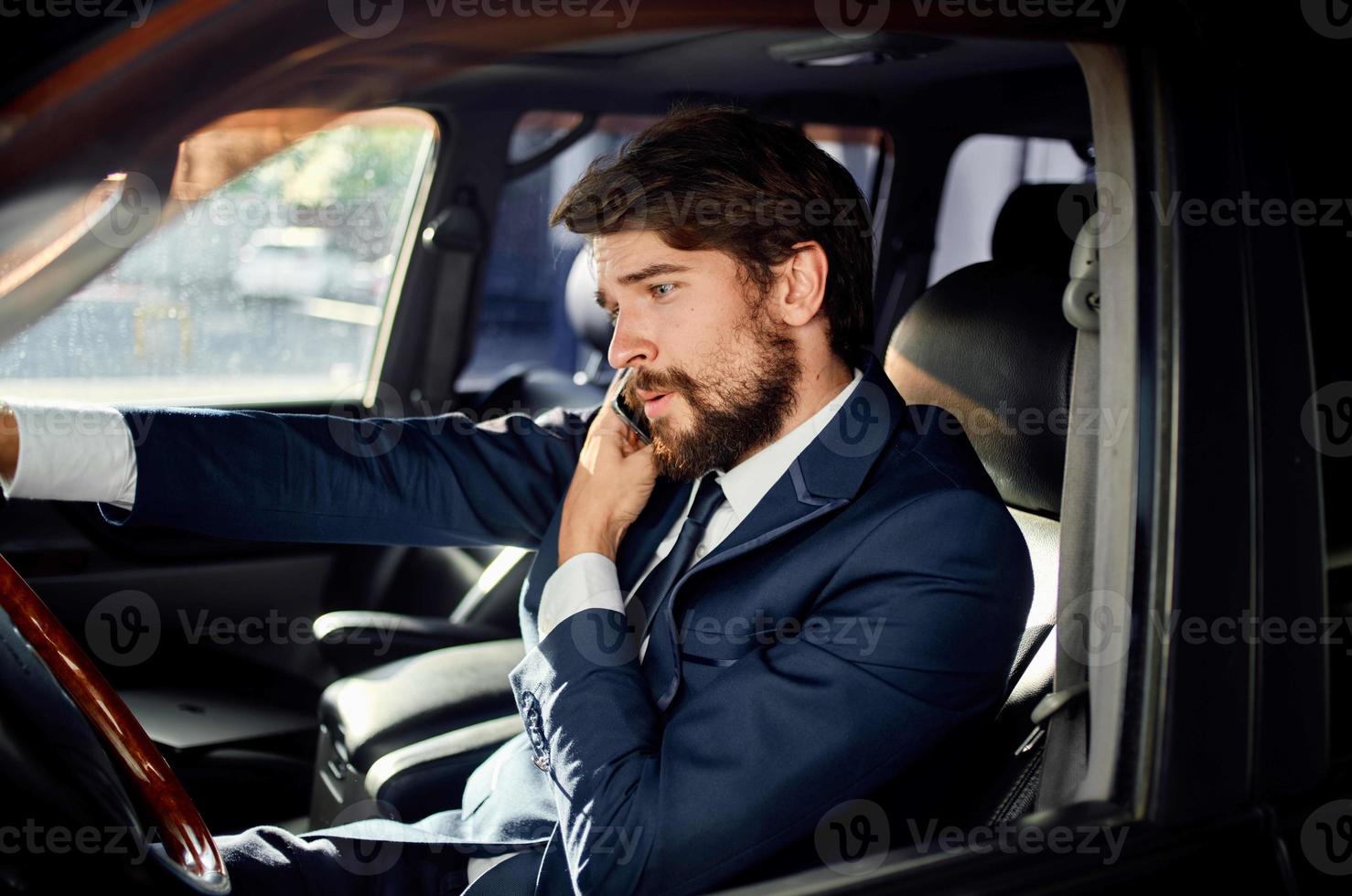 bearded man in a suit in a car a trip to work self confidence photo