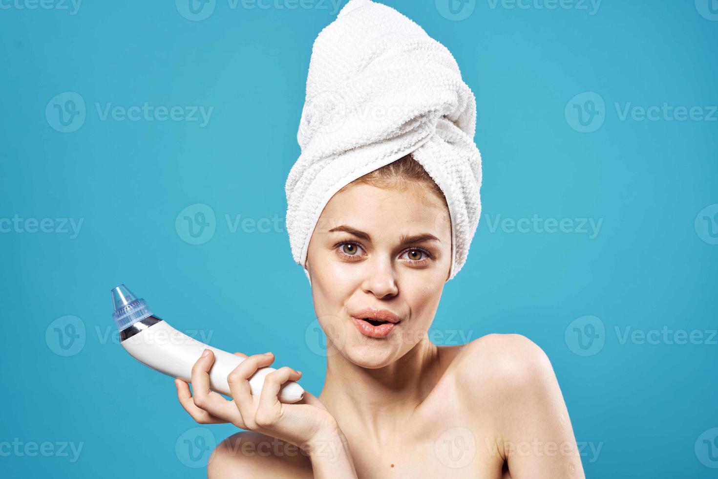 woman with bare shoulders with a towel on her head massage in the hands of a spa procedure photo