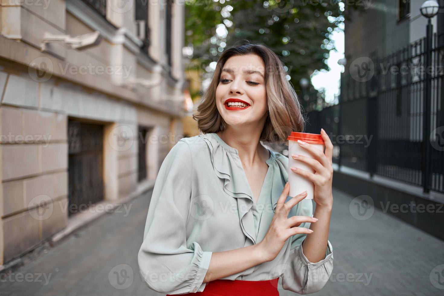 pretty woman red skirt coffee cup outdoors walk photo