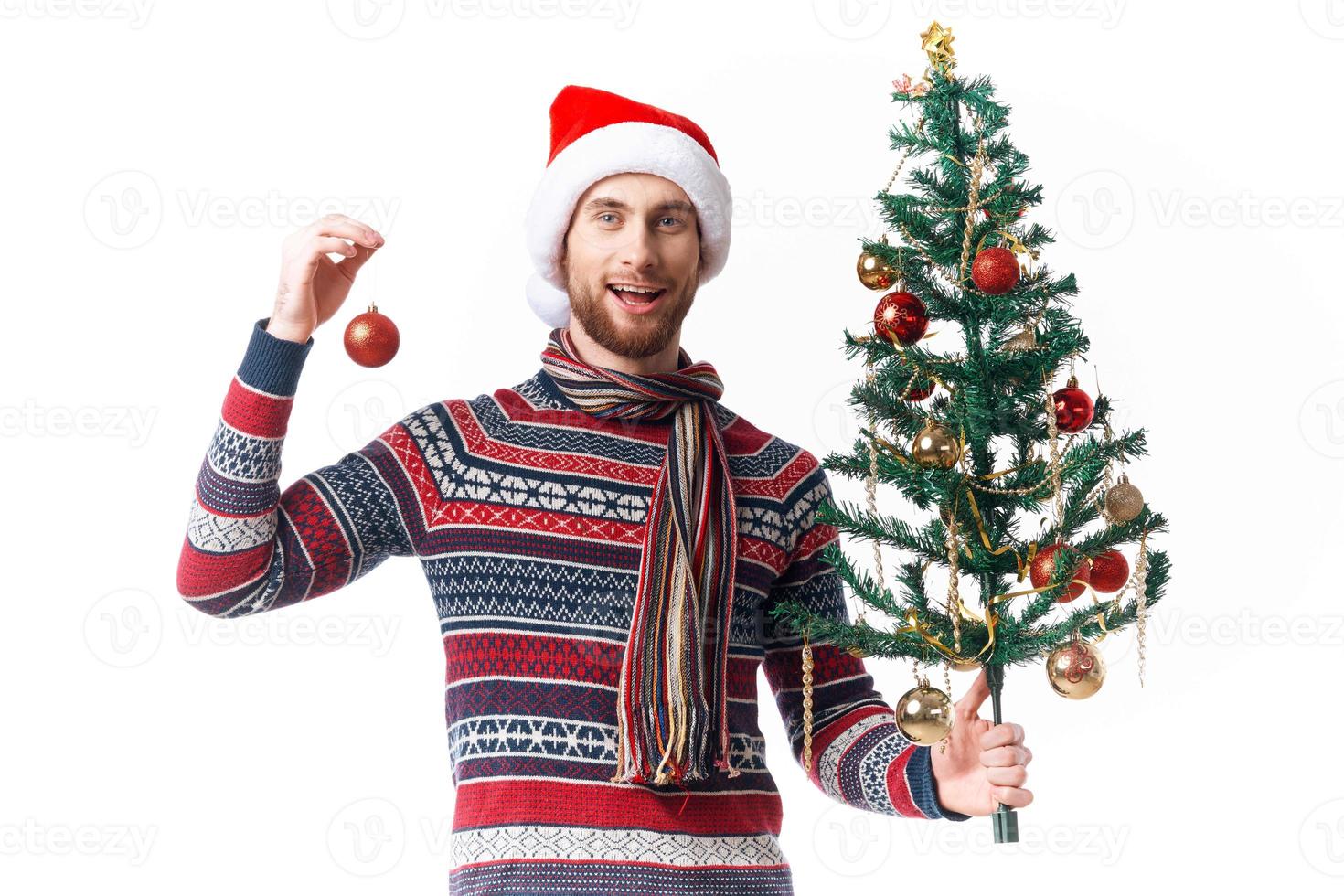 emotional man with a tree in his hands ornaments holiday fun isolated background photo