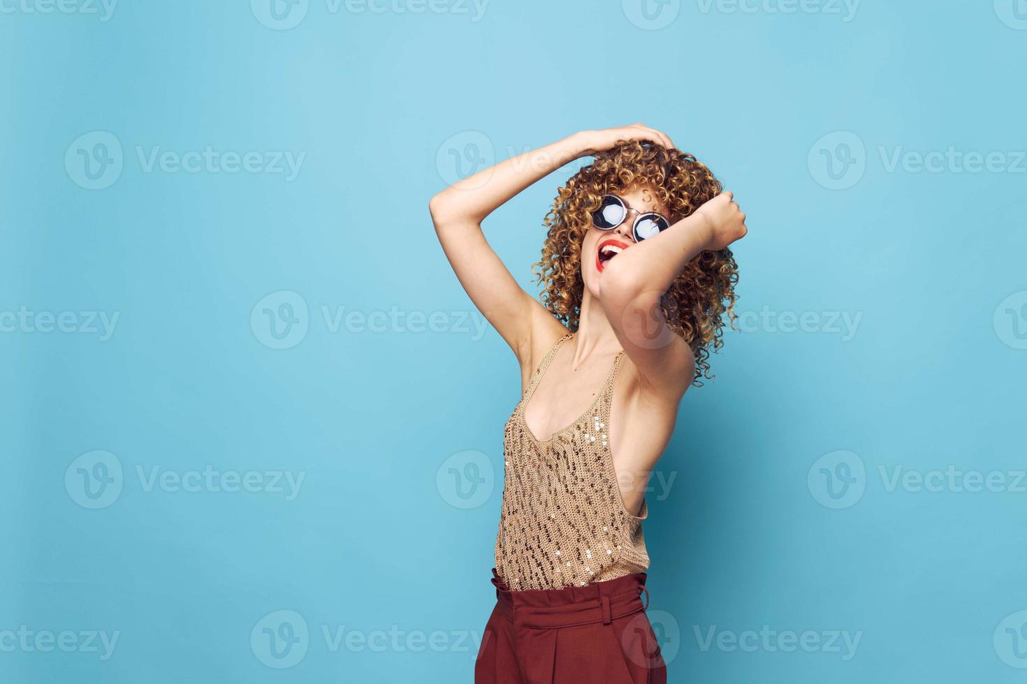 Charming model Spring hands on head emotions fashionable clothes lifestyle red pants photo