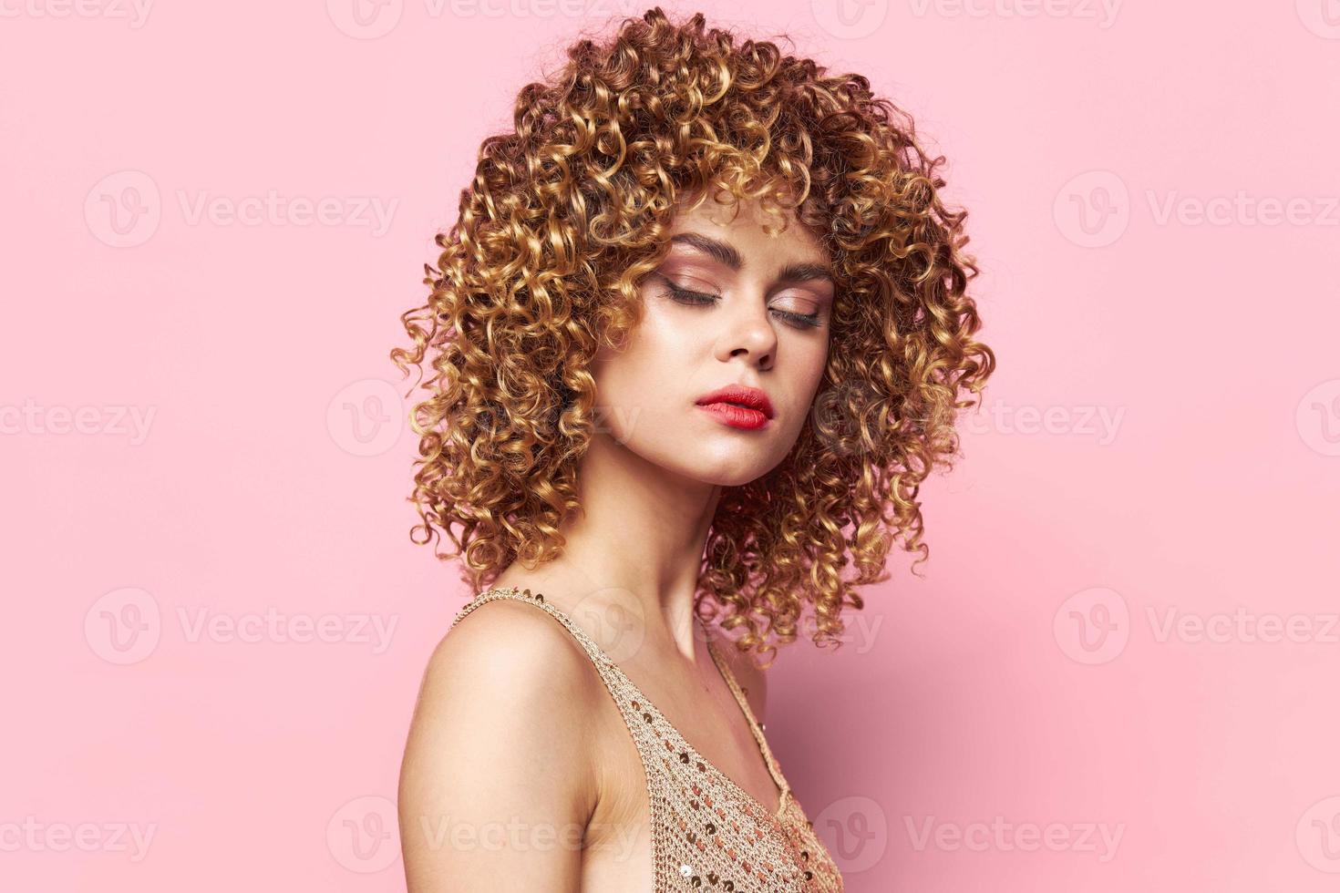 Beautiful woman Dress with sequins party disco makeup curly hair isolated background photo