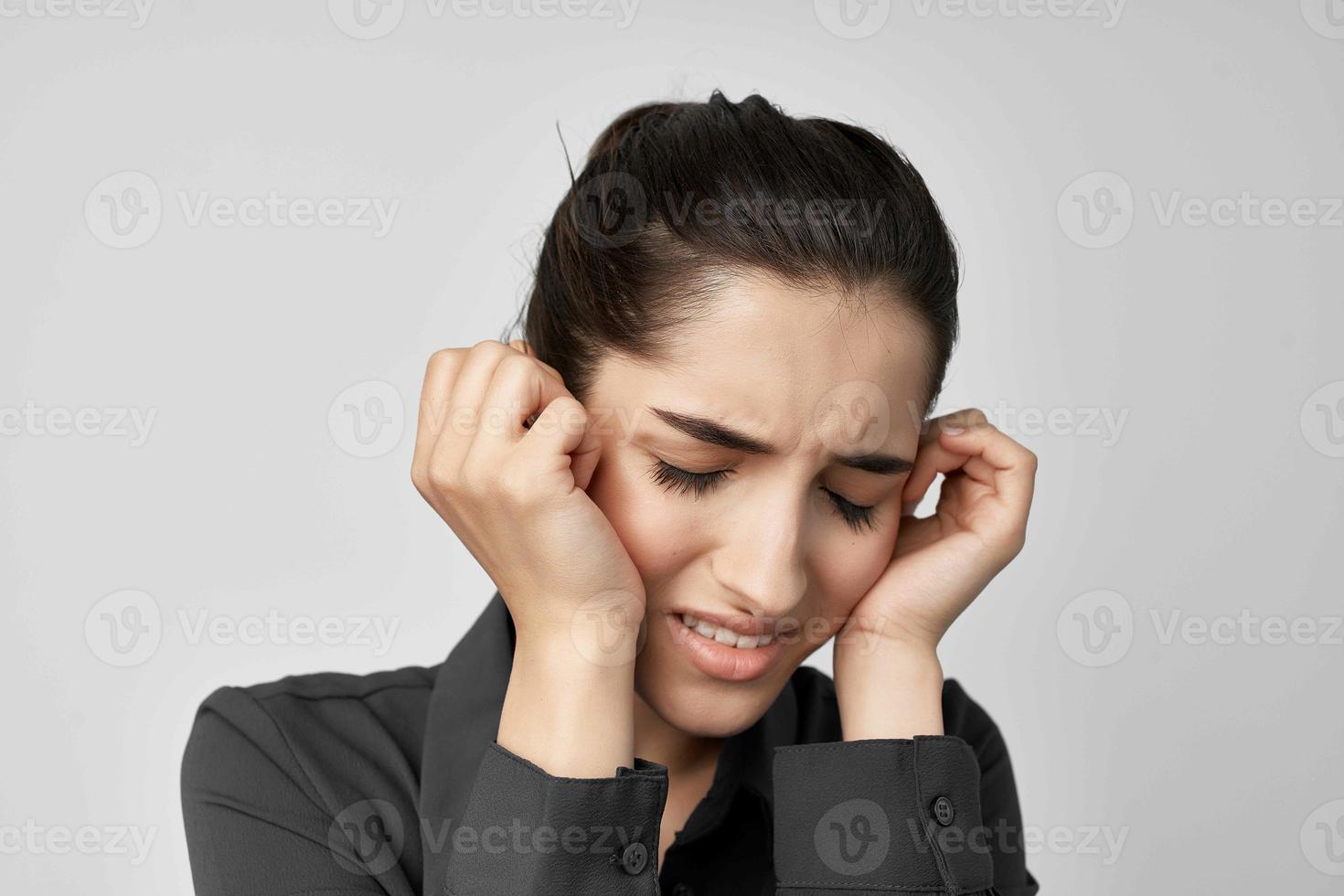 woman headache discontent trouble light background photo