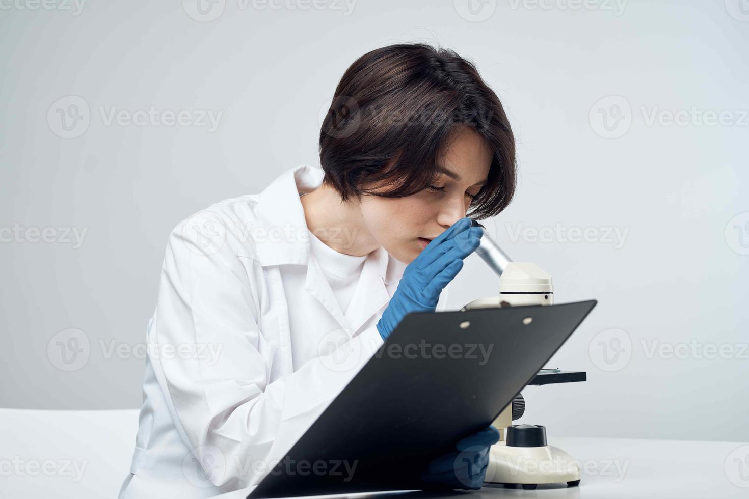 woman laboratory assistant microscope biology research science photo