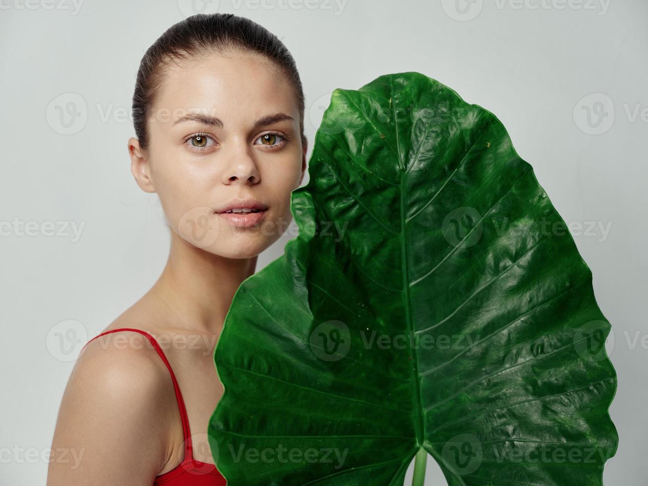 woman natural look green leaf palm tree clean skin photo