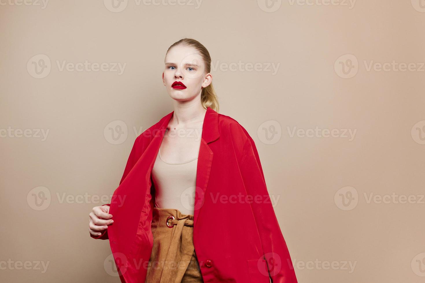 portrait of a woman makeup in red jacket isolated background photo