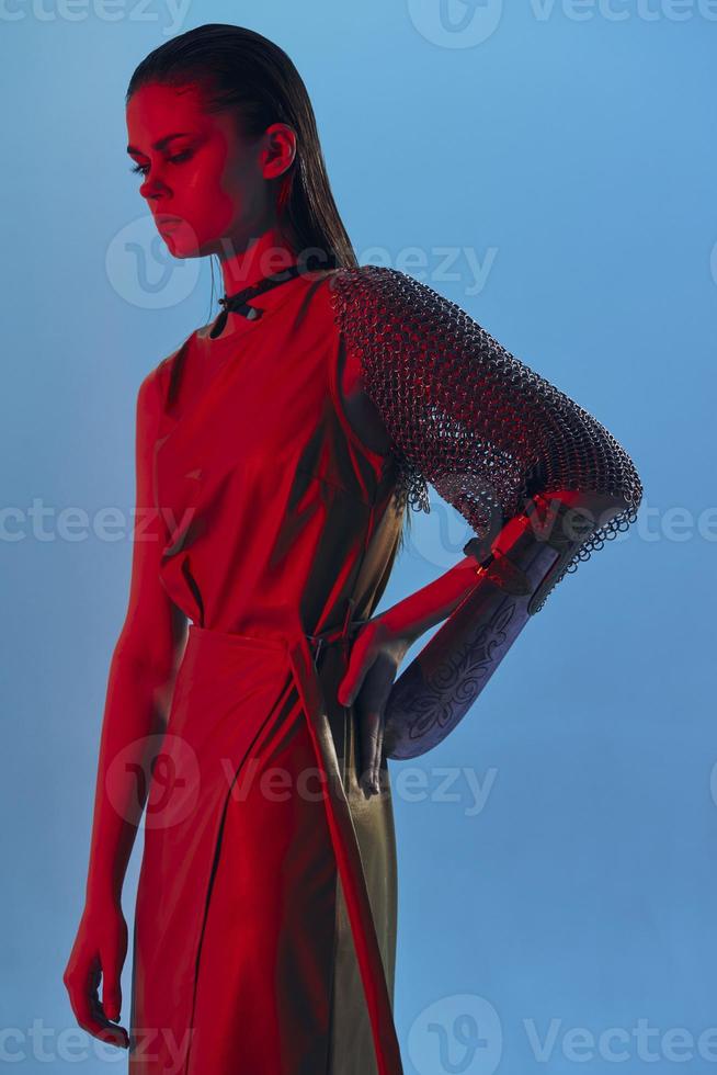 photo pretty woman in dress arm in armor chain mail protection Lifestyle unaltered