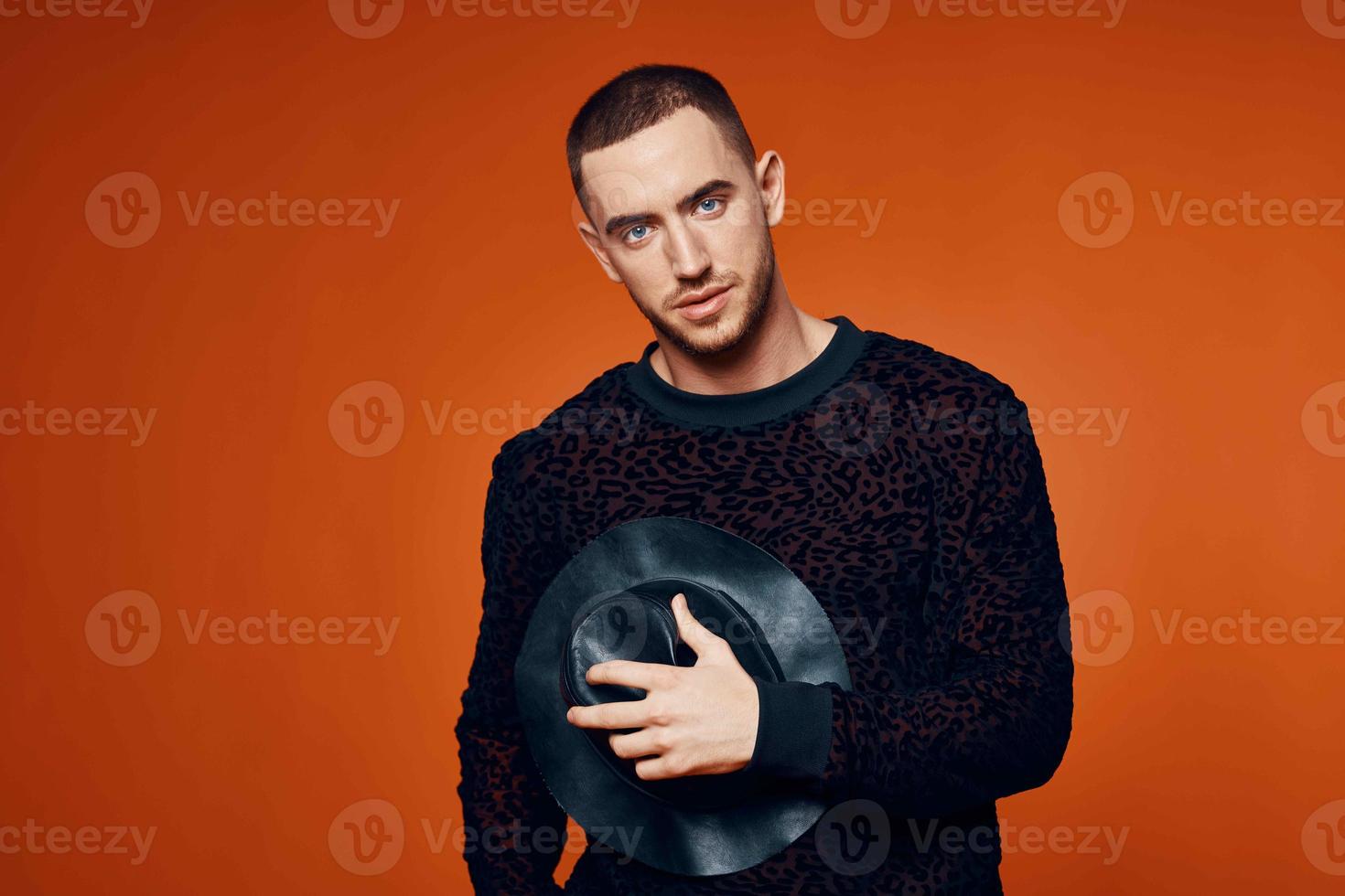 man in black sweater with hat fashion studio modern style photo