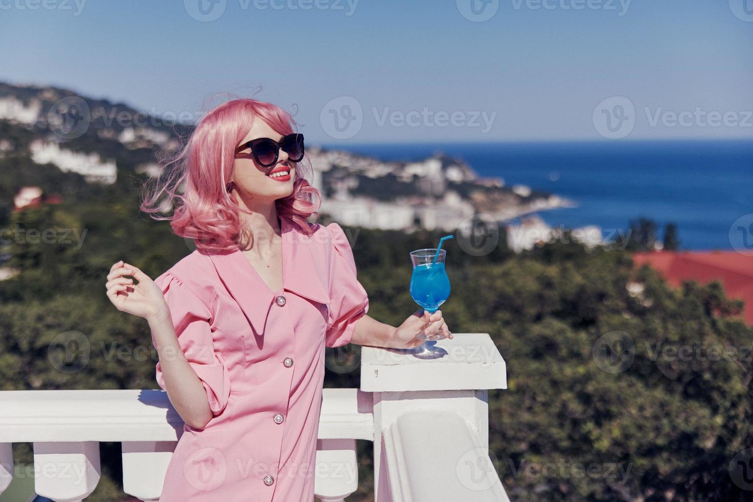 portrait of beautiful woman pink hair sunglasses leisure luxury vintage Drinking alcohol photo