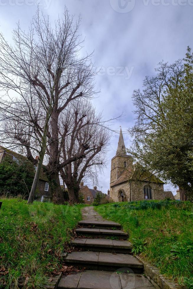 Steps and footpath leading towards a classical church in Cambridge, England photo