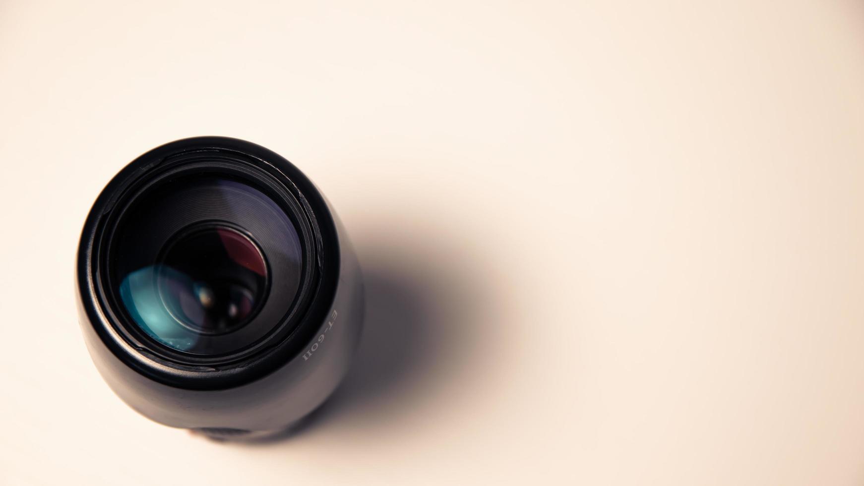 Camera lens on a white background. Close-up. Horizontal photo