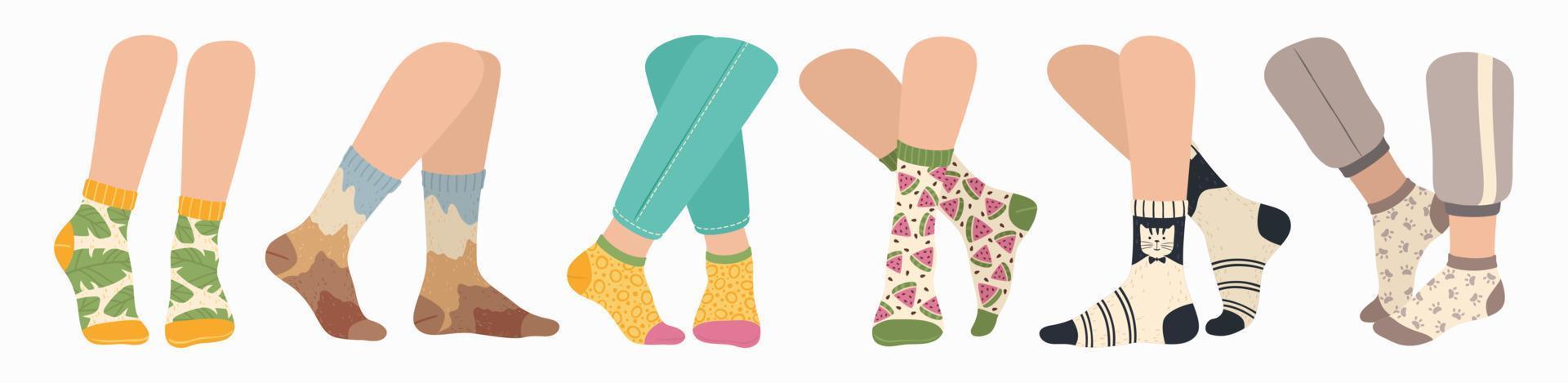 Legs in socks. Women and men wearing fashionable socks. Flat cartoon colorful sock with trendy pattern on feet, fashion accessories vector set