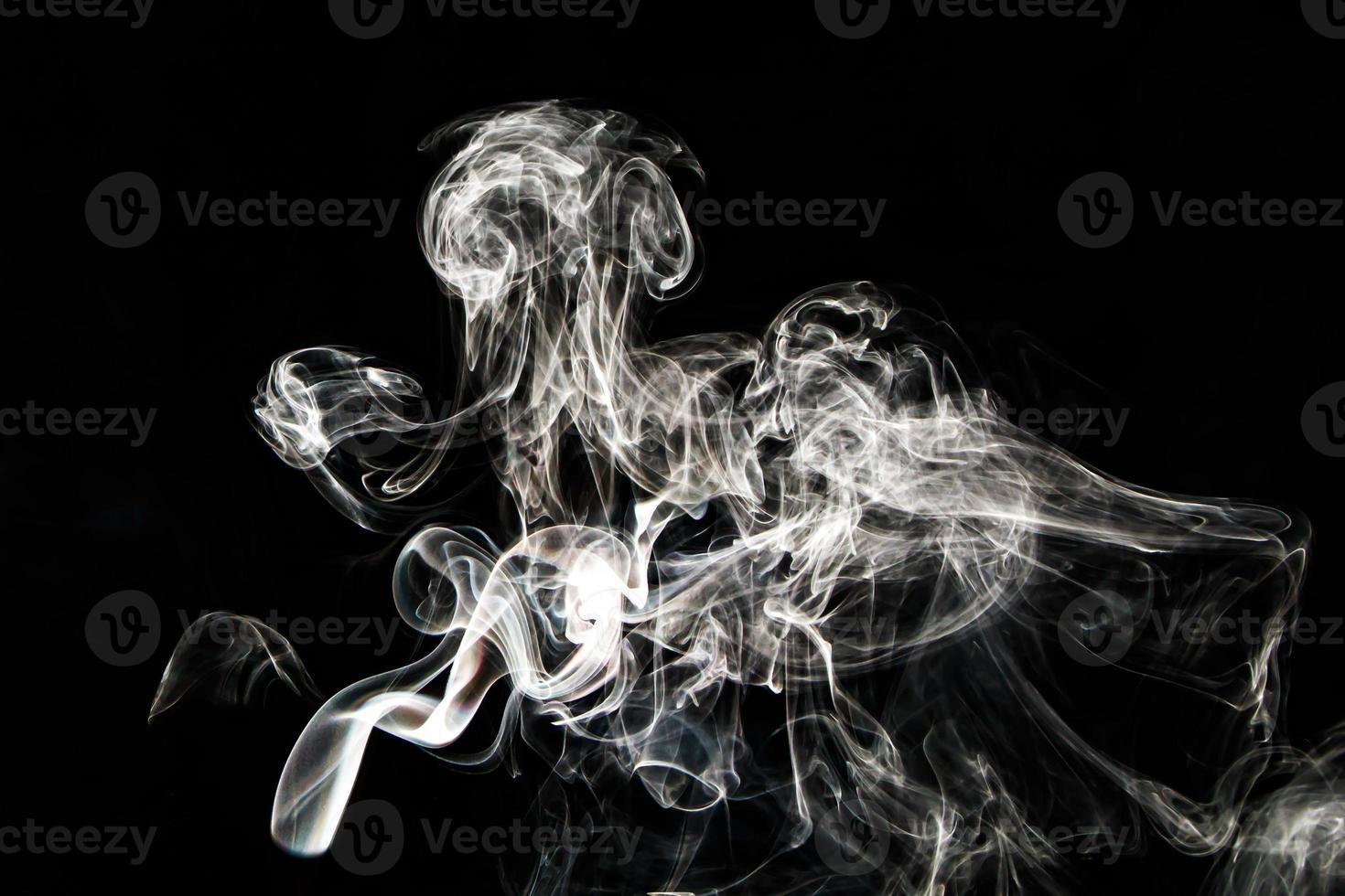 Smoke effect texture. Isolated background. Black and dark backdrop. Smokey fire and mistic effect. photo