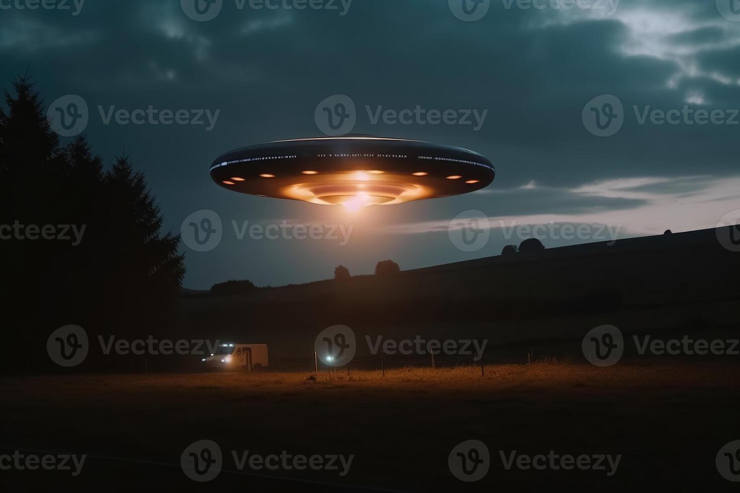 A close up view of a UFO with a spotlight pointed at the bottom of the landscape created with technology. photo