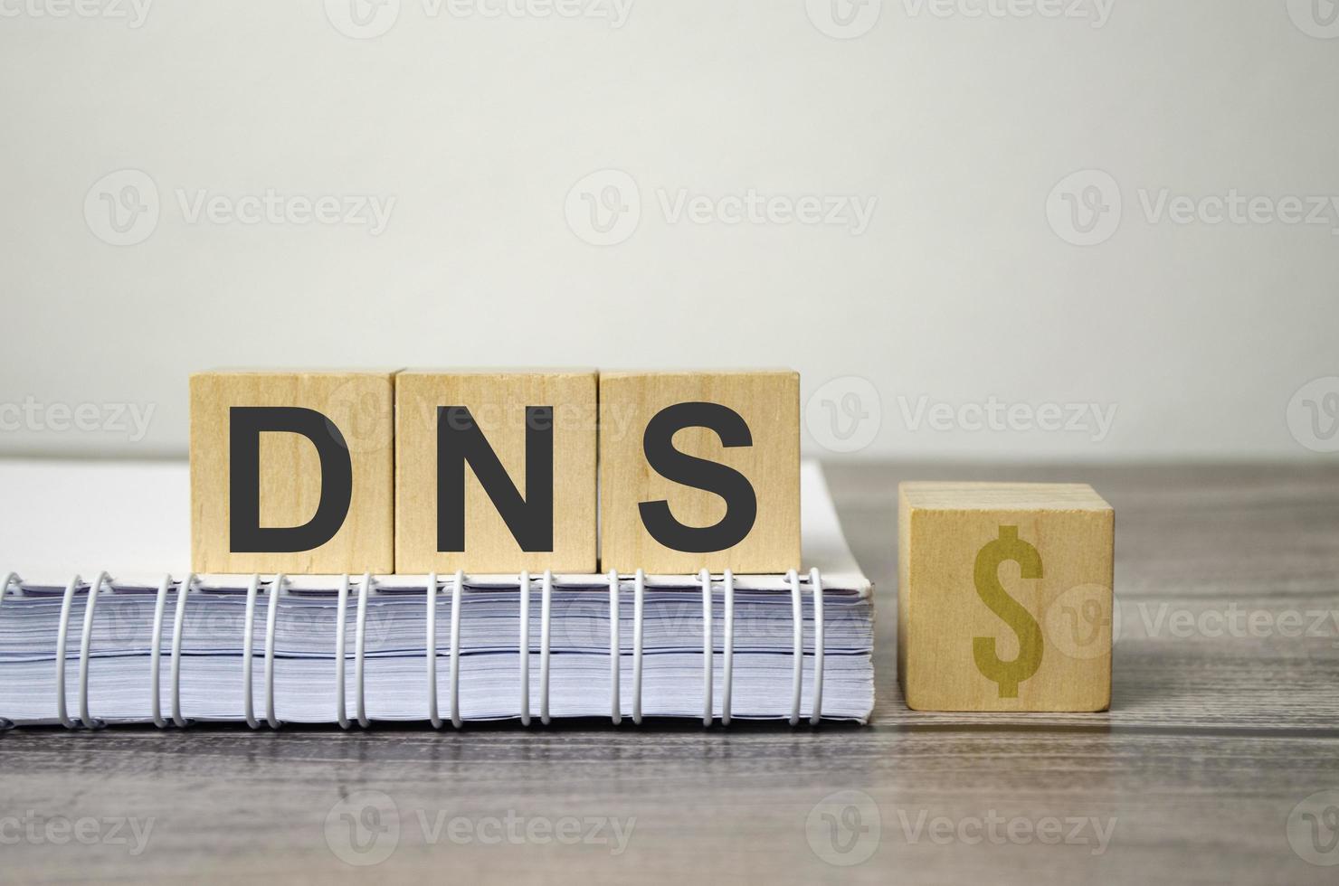 dns text from wooden blocks on a grey wooden background photo
