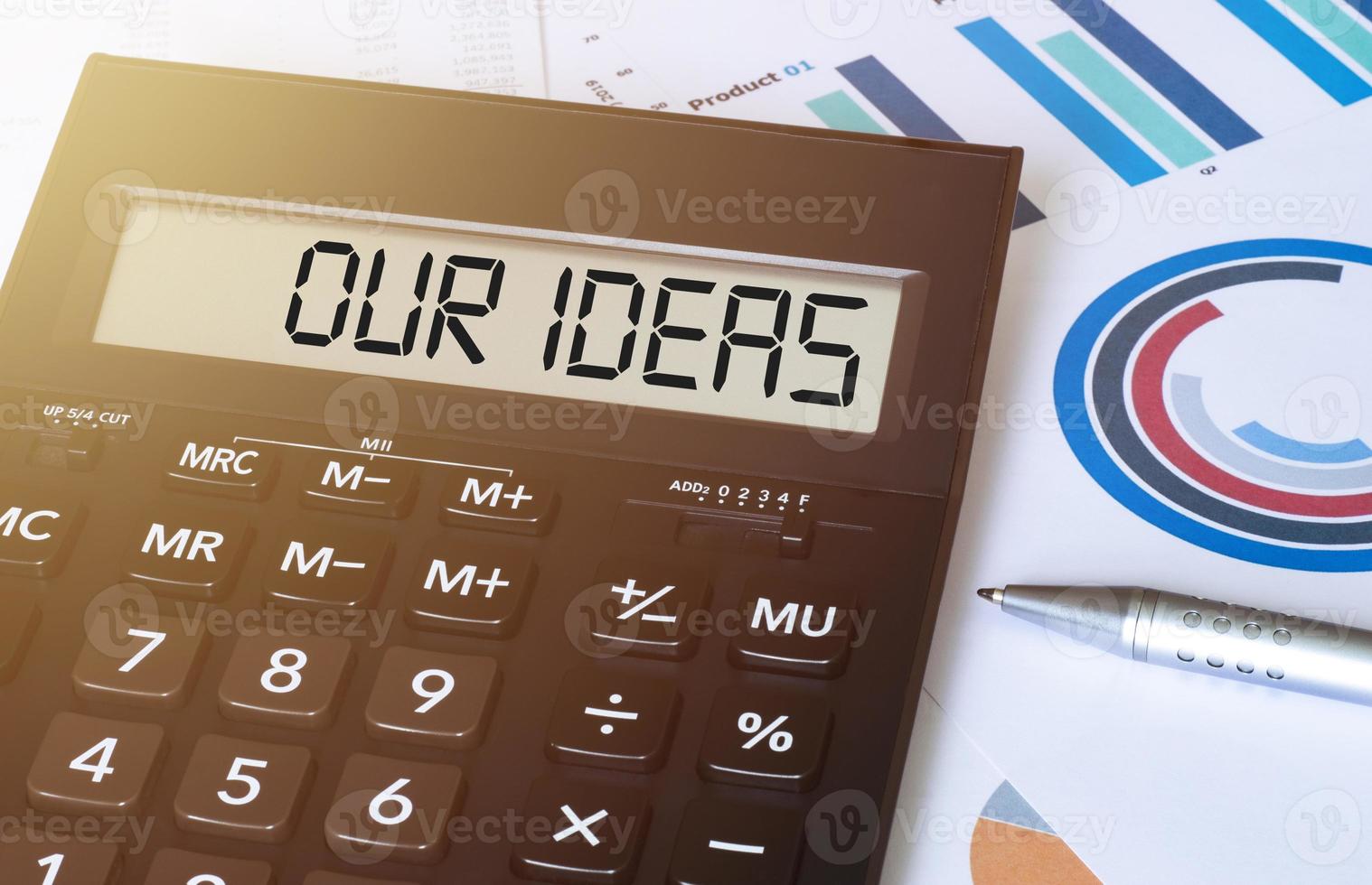 palabra nuestra ideas en calculadora. negocio y Finanzas concepto. foto
