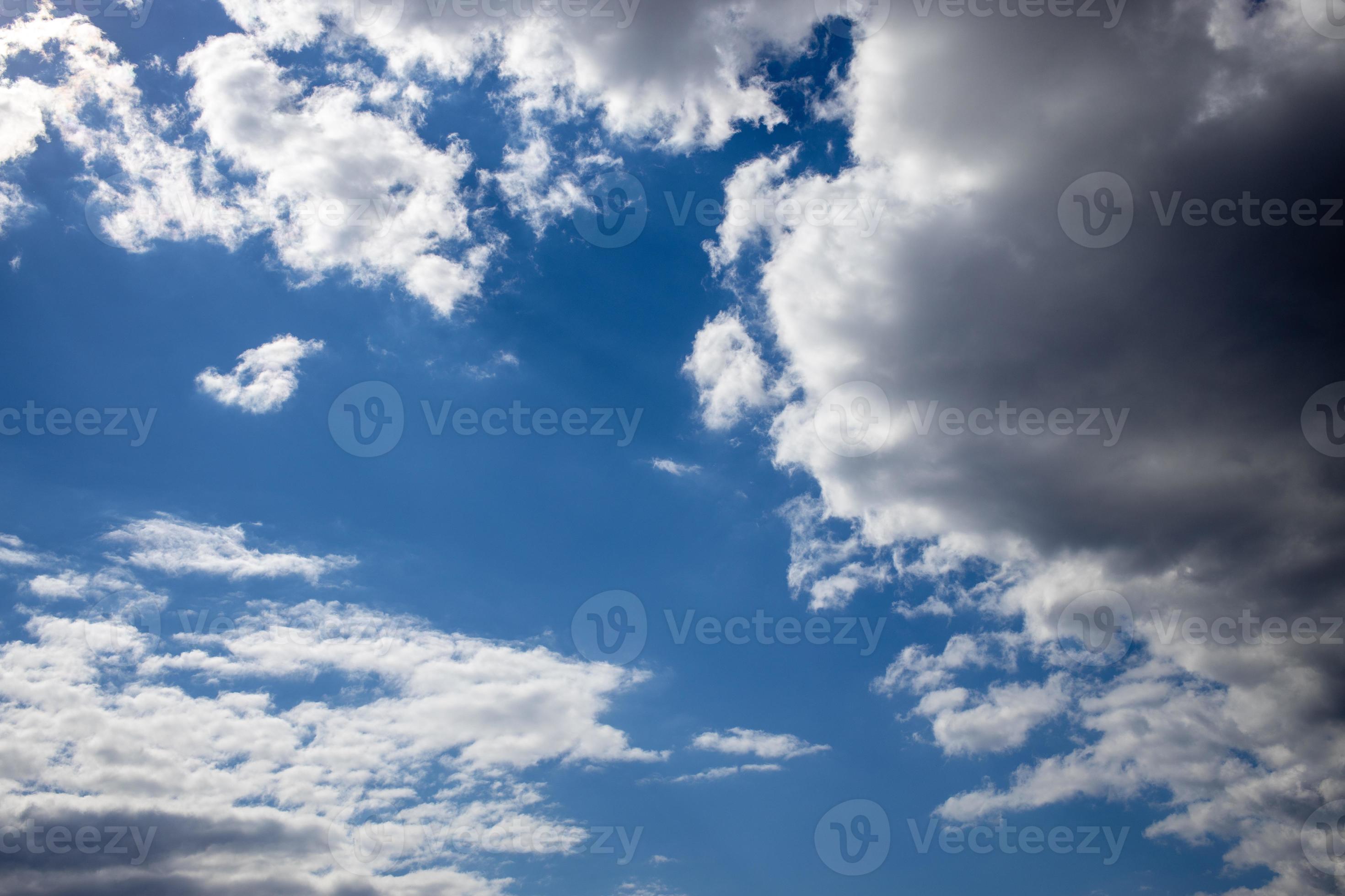blue sky on a sunny warm day with white and gray clouds 22398097 Stock
