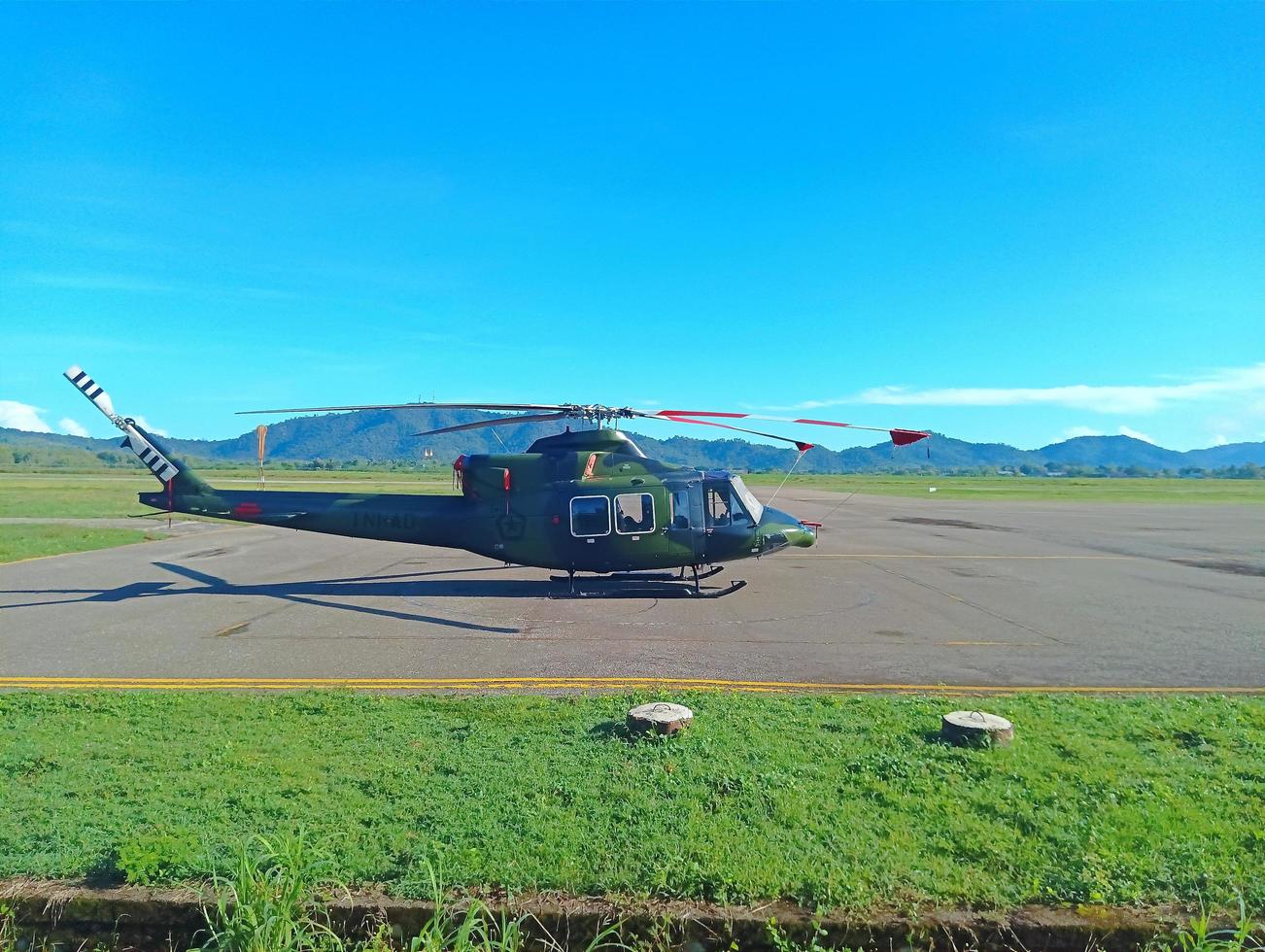 Atambua, Nusa Tenggara Timur, 2023 Indonesian National Armed Forces TNI Army helicopter parked on the airport runway helipad photo