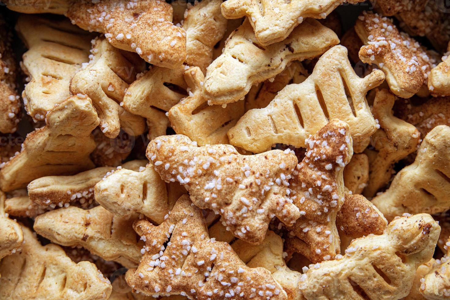 tasty background of cinnamon cakes from puff pastry in the shape of a Christmas tree in close-up photo