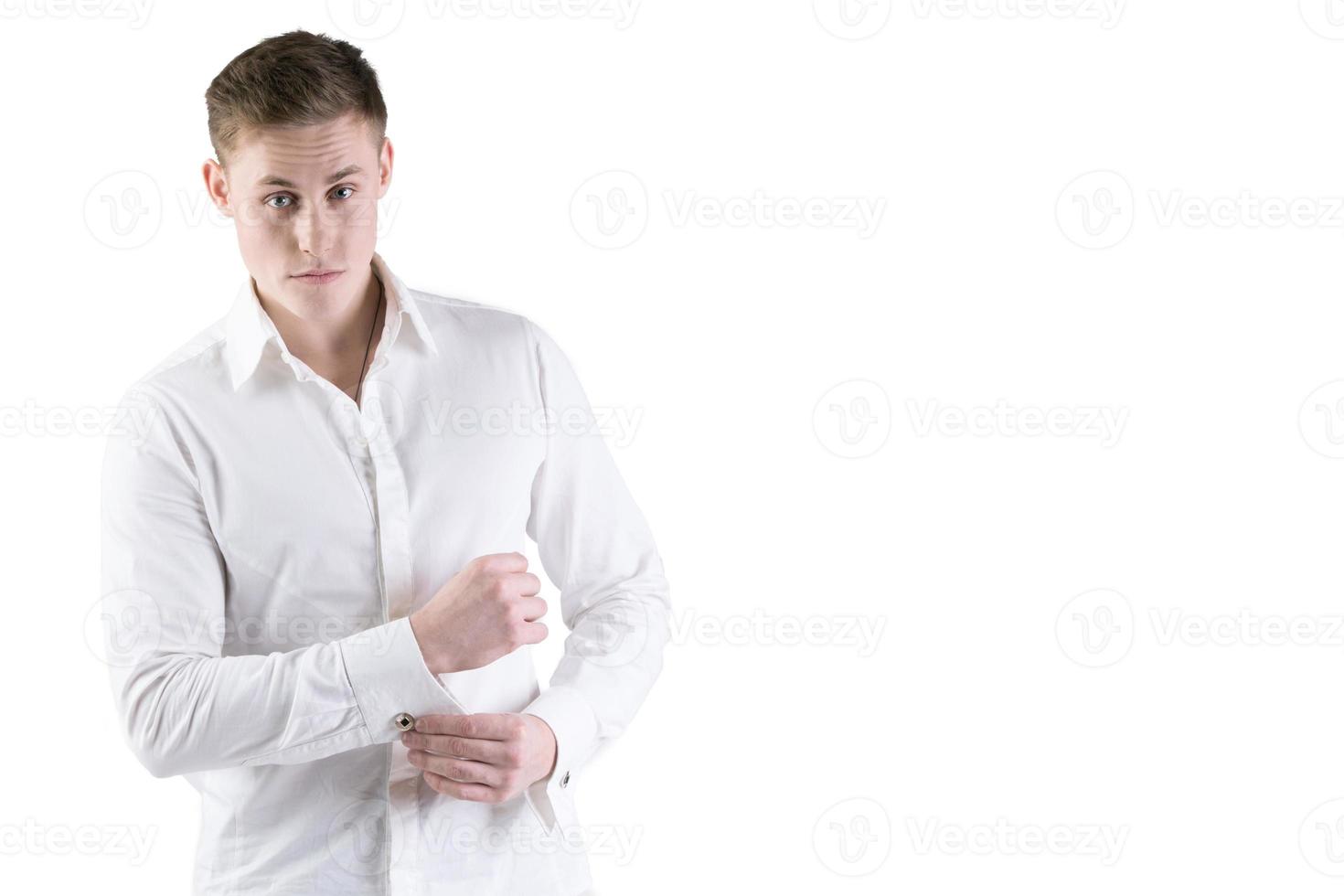 joven hombre en un blanco camisa en un blanco antecedentes. foto