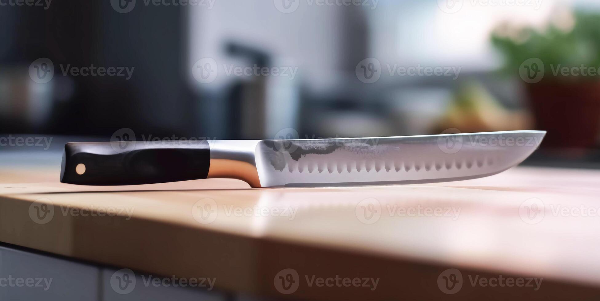 kitchen knife lies on a wooden table. photo