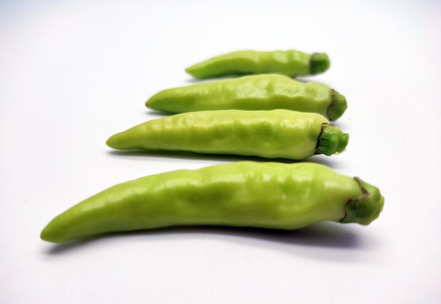 Light green chili pepper or Cayenne pepper isolated on white background photo