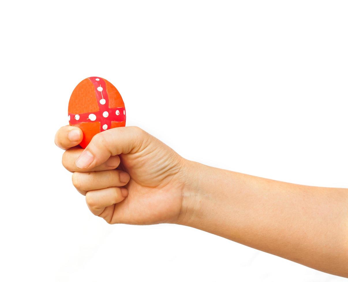 hand holding a easter egg on white photo
