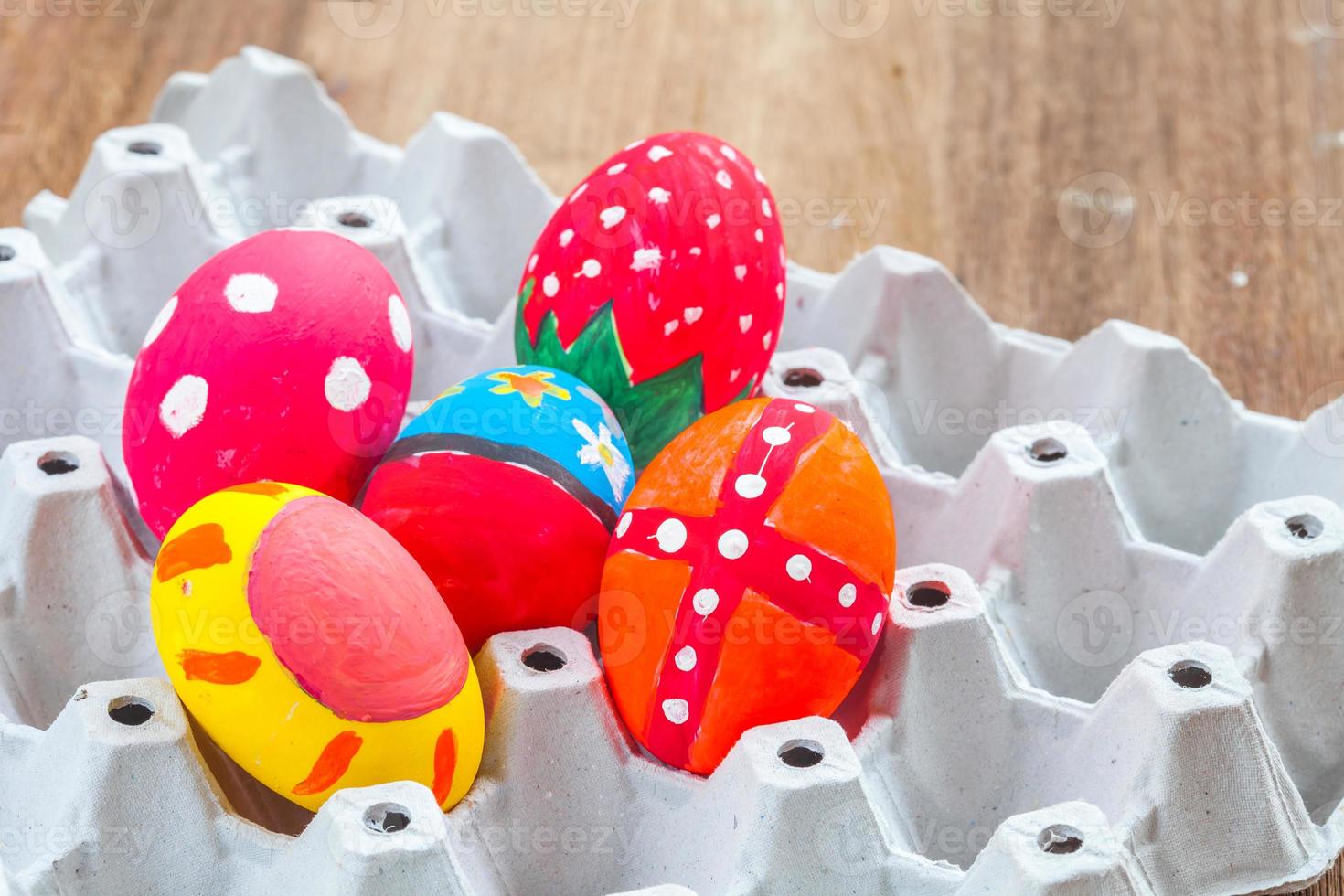 easter egg in basket on wood photo