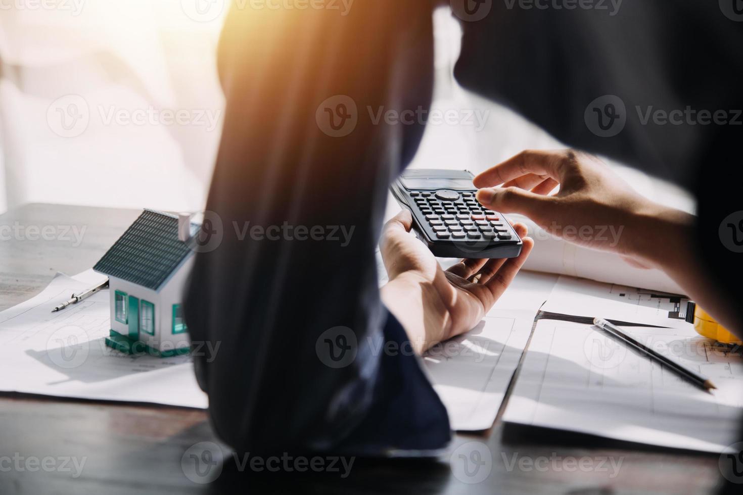Two business man construction site engineer. Engineering objects on workplace with partners interacting on background photo