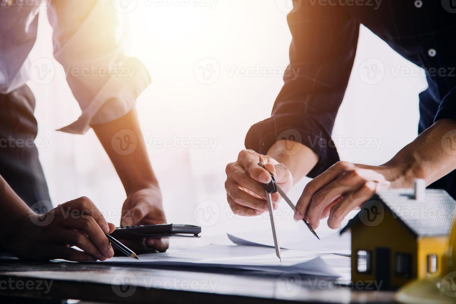Two business man construction site engineer. Engineering objects on workplace with partners interacting on background photo
