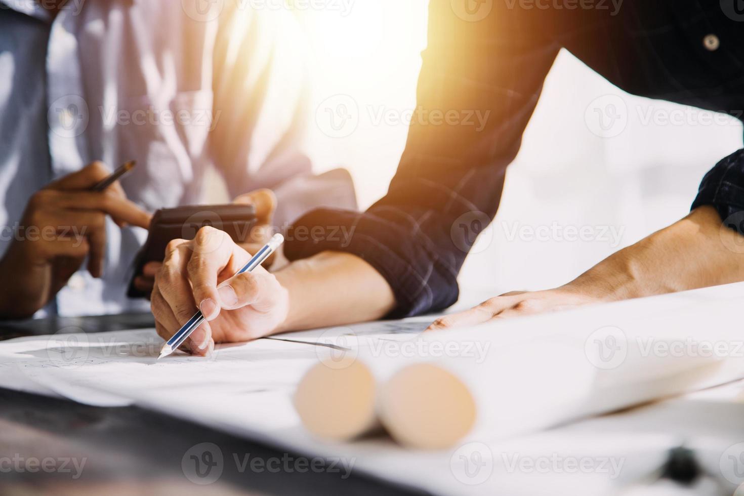 Two business man construction site engineer. Engineering objects on workplace with partners interacting on background photo