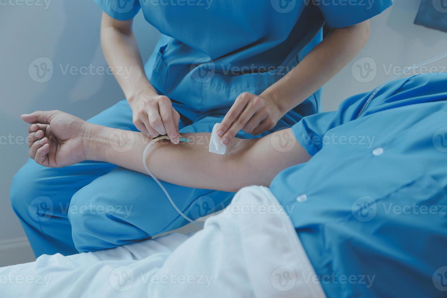 Women Asian doctors hold the patient hand and encourage and provide medical advice While checking the patient health in bed. Concept of Care and compassion, antenatal care, Threatened abortion photo