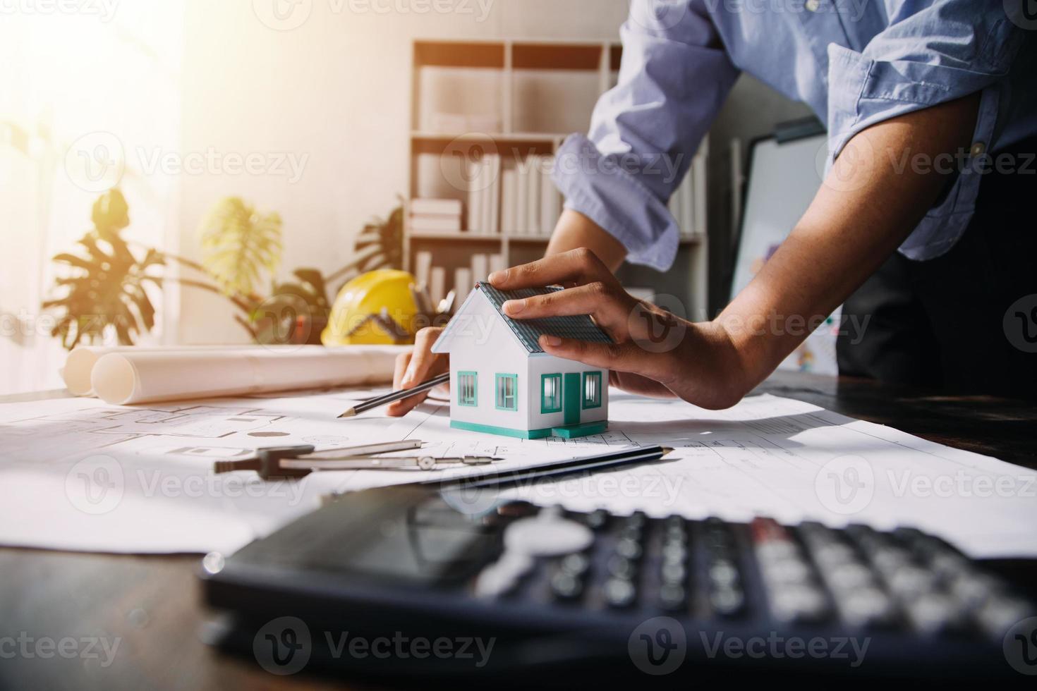 Two business man construction site engineer. Engineering objects on workplace with partners interacting on background photo