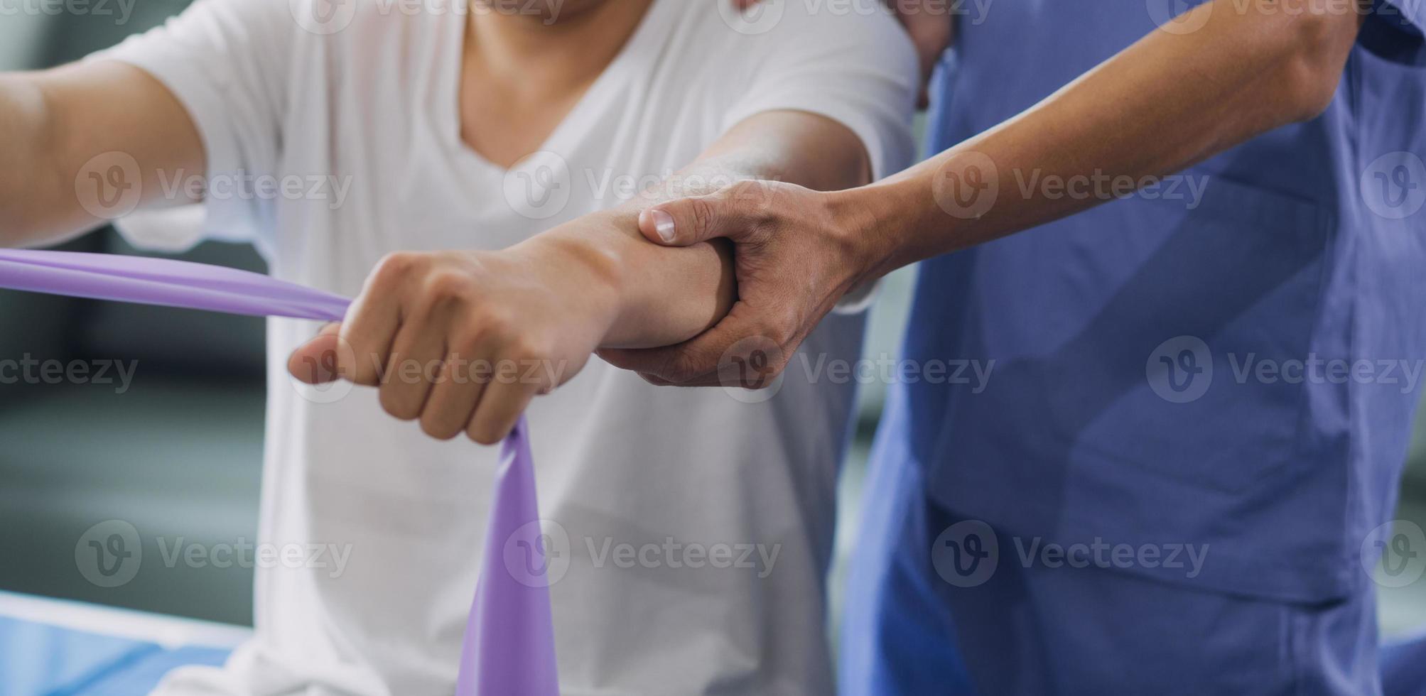 Patient doing some special exercises under supervision in a room photo