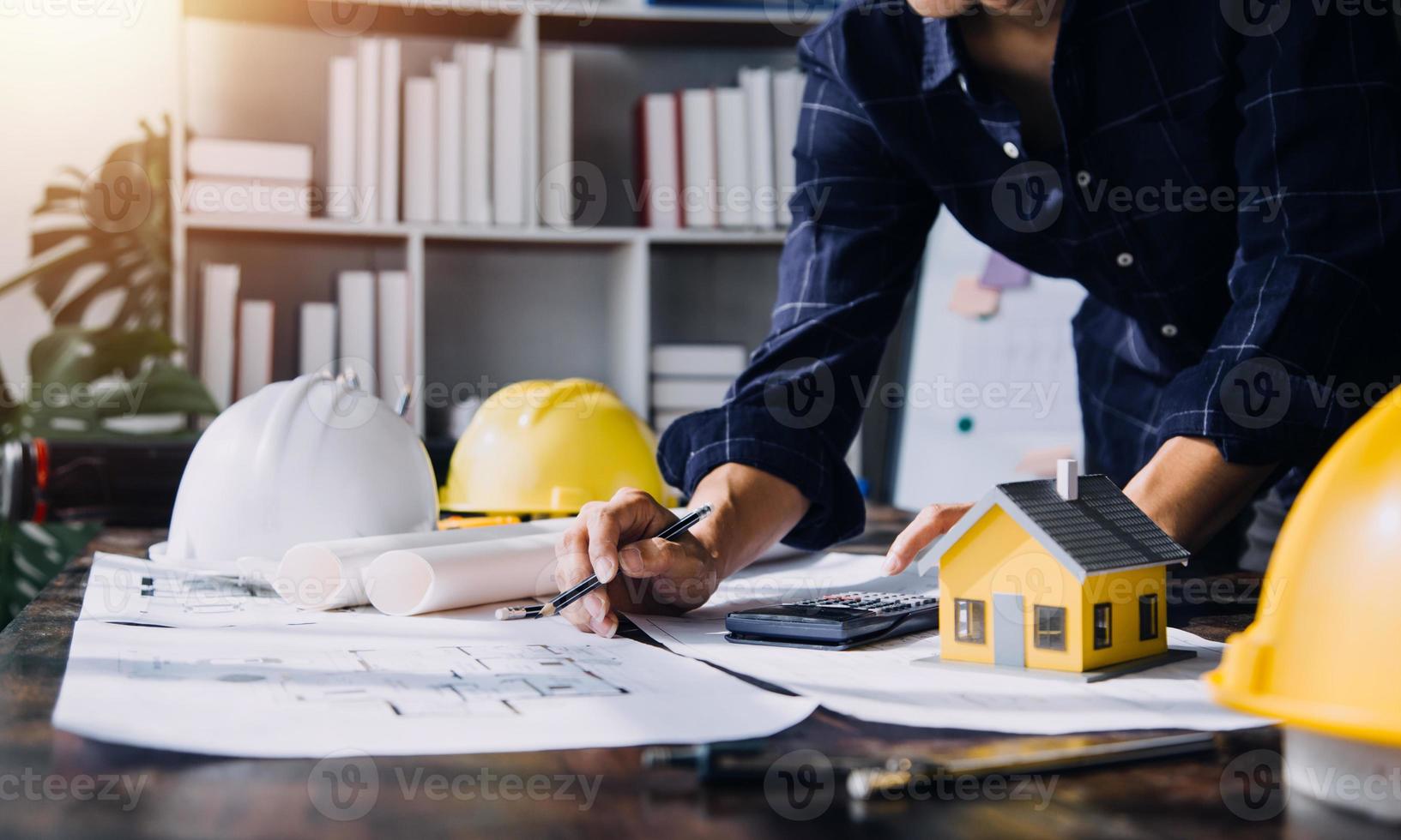 Two business man construction site engineer. Engineering objects on workplace with partners interacting on background photo