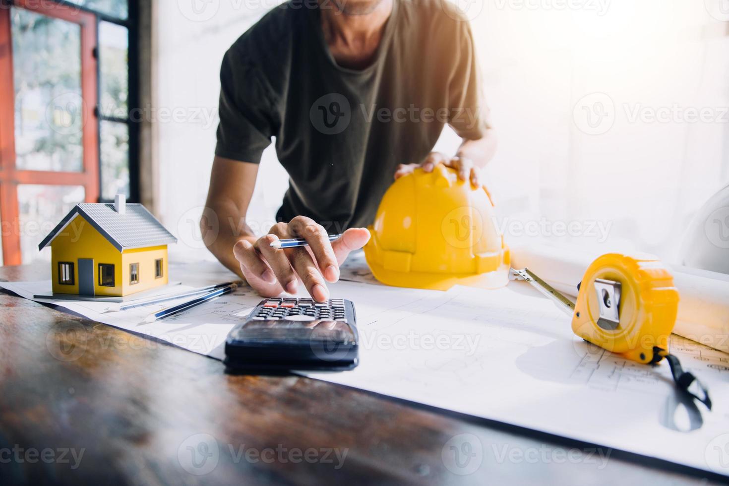 Two business man construction site engineer. Engineering objects on workplace with partners interacting on background photo